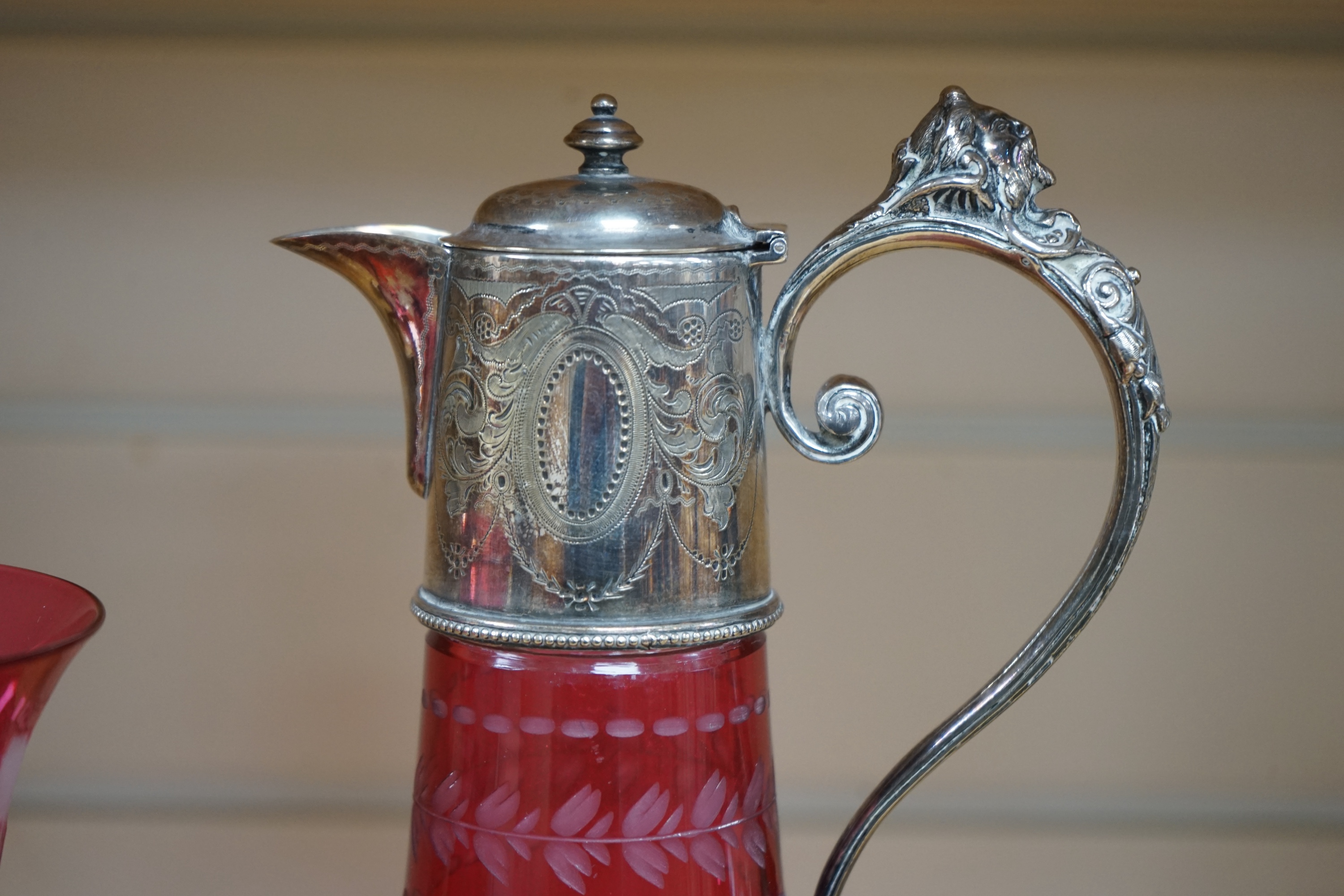 A Victorian electroplate mounted cranberry glass claret jug and a similar goblet by Elkington & Co. 26cm. Condition - good